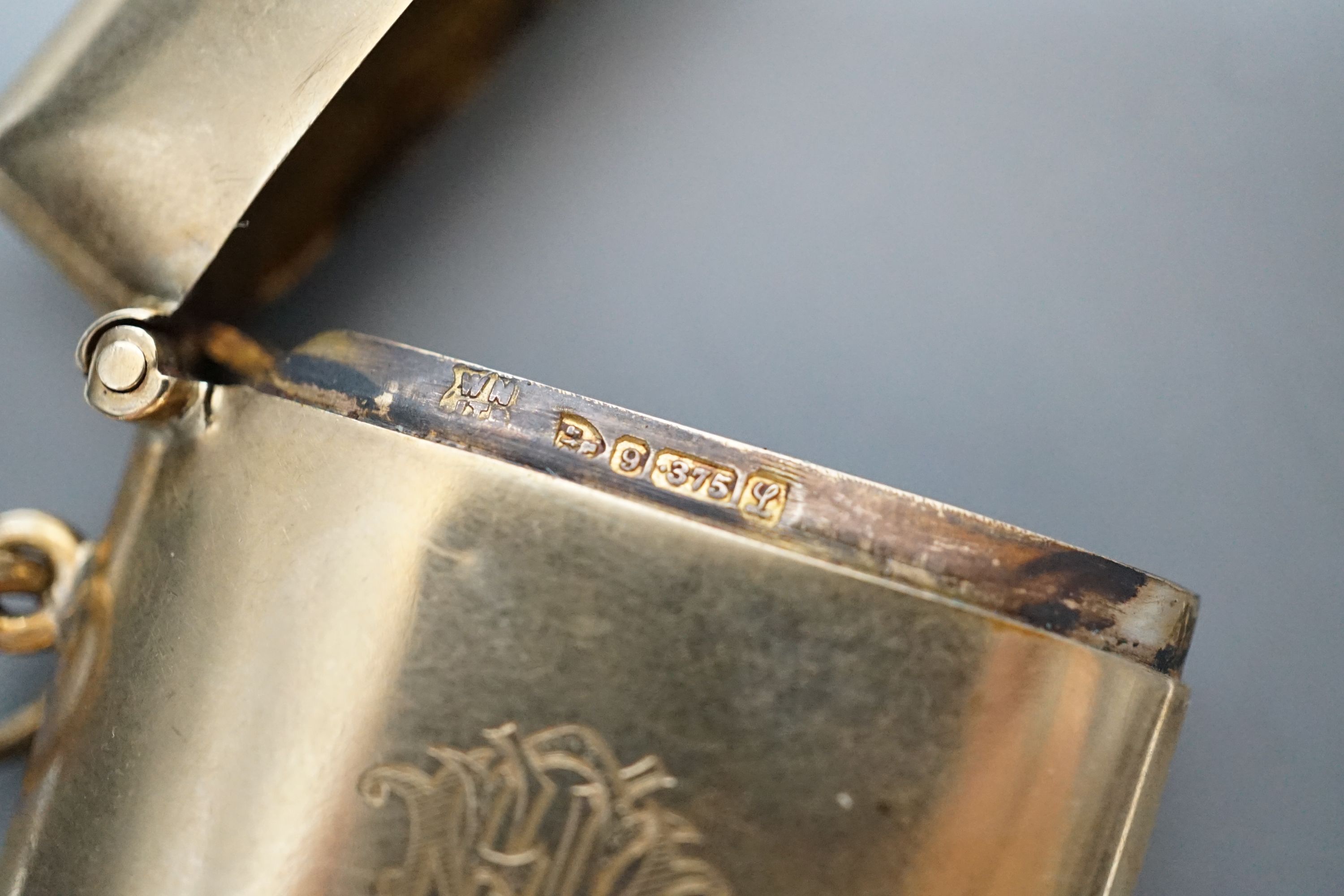 A George V 9ct gold vest case, with engraved monogram, William Neale Ltd, Chester, 1911, 46mm, gross weight 15.2 grams.